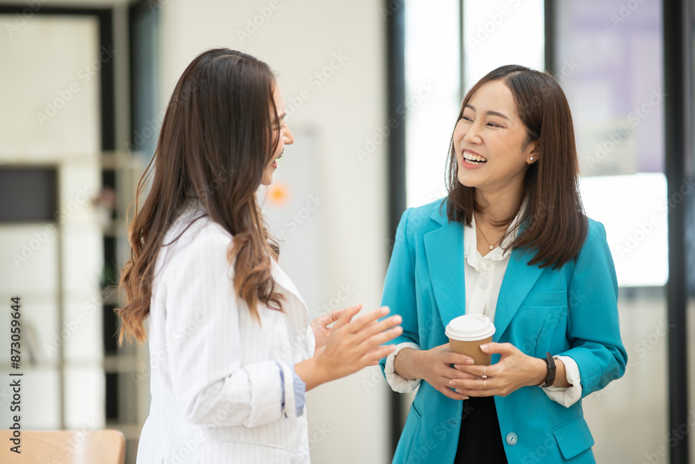Business women Discuss and plan work on graph documents at the office. Business women Discuss and plan work on graph documents at the office.