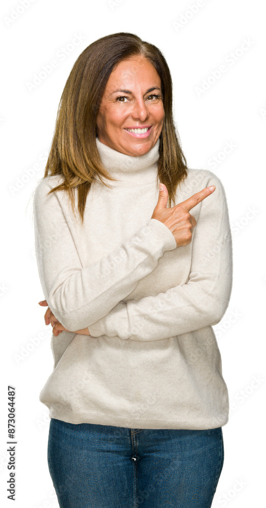 Beautiful middle age adult woman wearing winter sweater over isolated background cheerful with a smile of face pointing with hand and finger up to the side with happy and natural expression on face. Beautiful middle age adult woman wearing winter sweater over isolated background cheerful with a smile of face pointing with hand and finger up to the side with happy and natural expression on face.