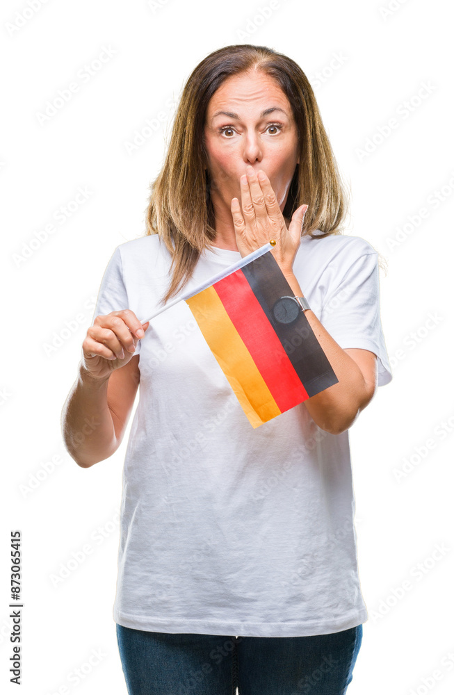 Middle age hispanic woman holding flag of Germany over isolated background cover mouth with hand shocked with shame for mistake, expression of fear, scared in silence, secret concept Middle age hispanic woman holding flag of Germany over isolated background cover mouth with hand shocked with shame for mistake, expression of fear, scared in silence, secret concept