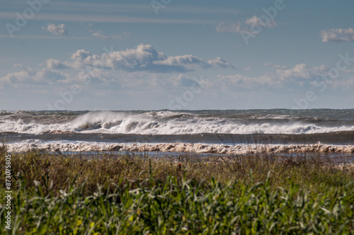 Waves breaking on the shore in brazil photo