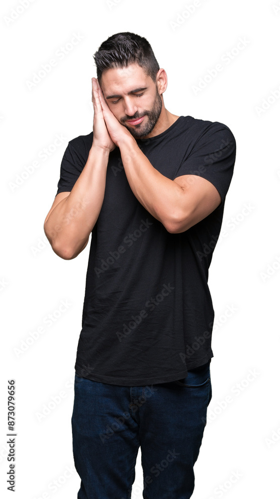 Young handsome man over isolated background sleeping tired dreaming and posing with hands together while smiling with closed eyes. Young handsome man over isolated background sleeping tired dreaming and posing with hands together while smiling with closed eyes.