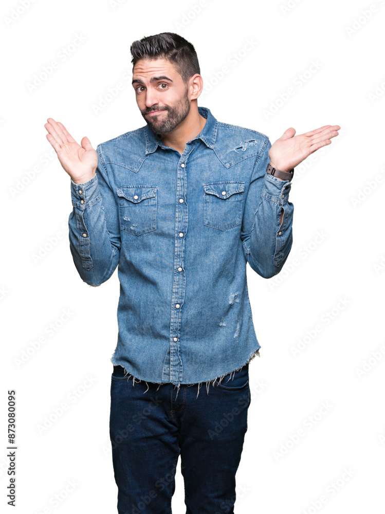 Fototapeta premium Young handsome man over isolated background clueless and confused expression with arms and hands raised. Doubt concept.