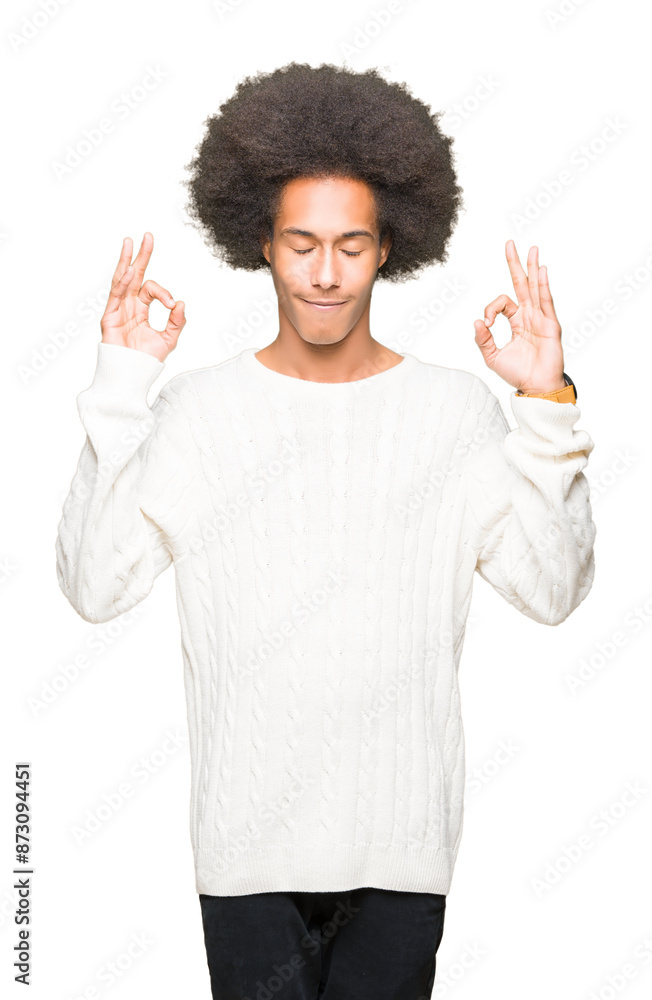 Young african american man with afro hair wearing winter sweater relax and smiling with eyes closed doing meditation gesture with fingers. Yoga concept. Young african american man with afro hair wearing winter sweater relax and smiling with eyes closed doing meditation gesture with fingers. Yoga concept.
