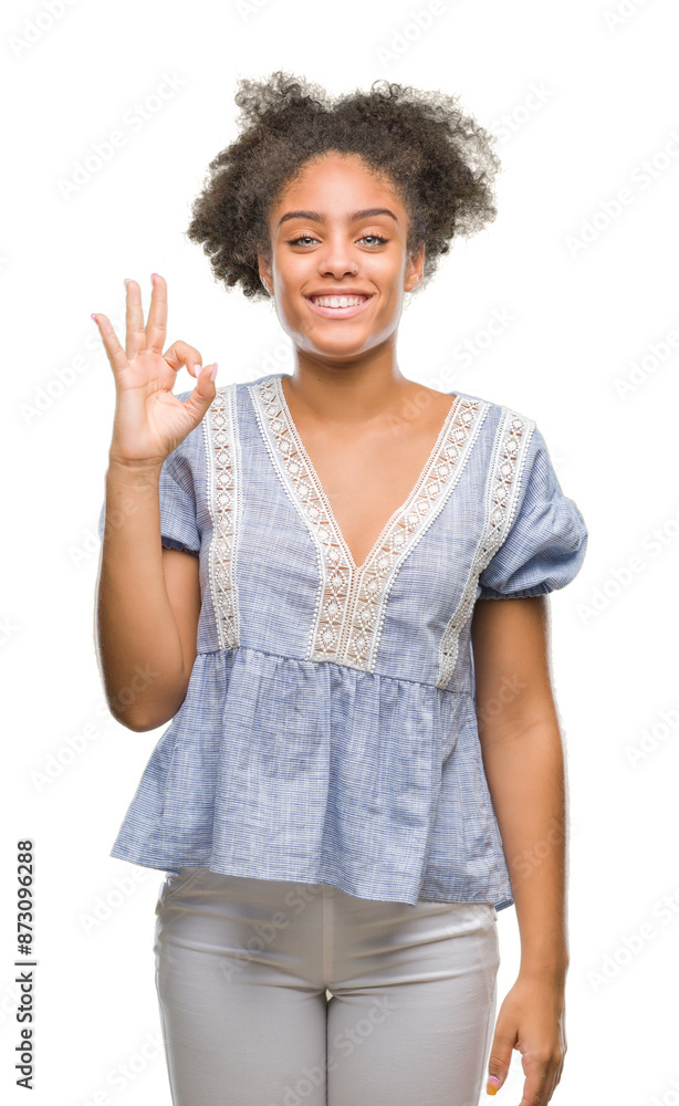 Young afro american woman over isolated background smiling positive doing ok sign with hand and fingers. Successful expression. Young afro american woman over isolated background smiling positive doing ok sign with hand and fingers. Successful expression.