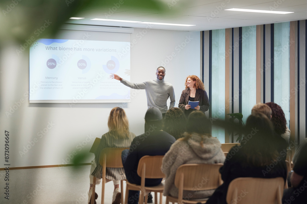 Multiracial business people giving presentation during meeting in office Multiracial business people giving presentation during meeting in office