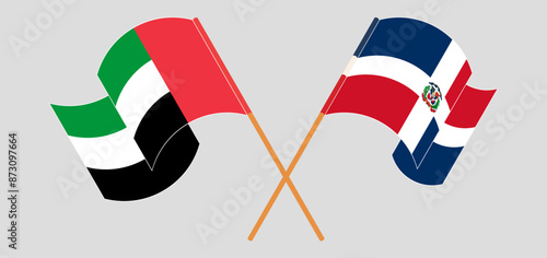Crossed and waving flags of the United Arab Emirates and Dominican Republic