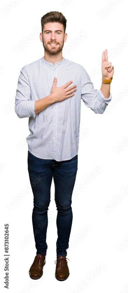 Young handsome man Swearing with hand on chest and fingers, making a loyalty promise oath Young handsome man Swearing with hand on chest and fingers, making a loyalty promise oath