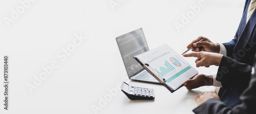 Financial advisor is discussing statistical data analysis and financial planning. Businessman discuss analyzing data, charts and graph of business financial growth and planning investment strategies.