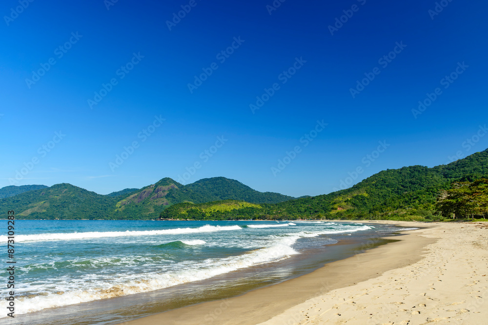 The sea and the beach next to the mountains and forest of Bonete beach on the island of Ilhabela The sea and the beach next to the mountains and forest of Bonete beach on the island of Ilhabela