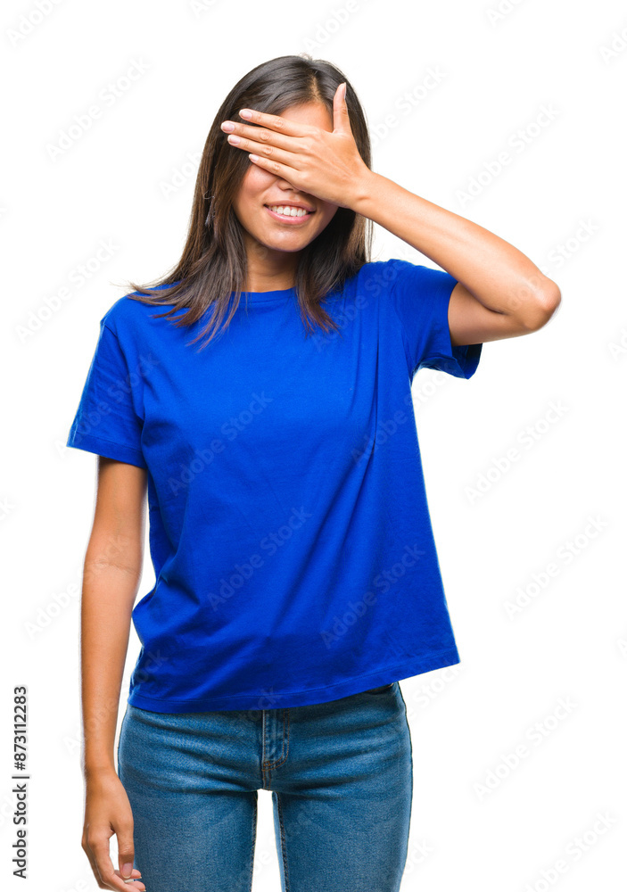 Young asian woman over isolated background smiling and laughing with hand on face covering eyes for surprise. Blind concept. Young asian woman over isolated background smiling and laughing with hand on face covering eyes for surprise. Blind concept.