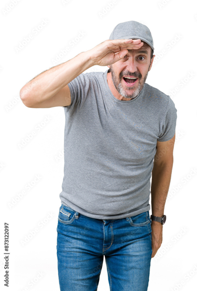 Handsome middle age hoary senior man wearing sport cap over isolated background very happy and smiling looking far away with hand over head. Searching concept. Handsome middle age hoary senior man wearing sport cap over isolated background very happy and smiling looking far away with hand over head. Searching concept.