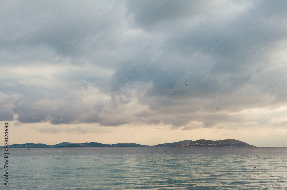 Beautiful landscape with dramatic sky, sea and islands Beautiful landscape with dramatic sky, sea and islands
