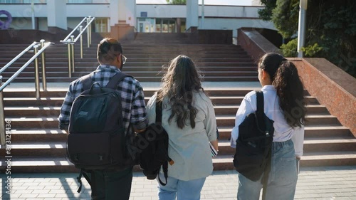 Indian students going to class, rear view