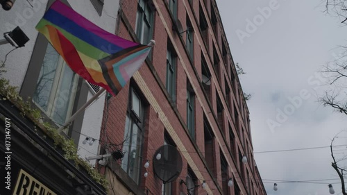 The rainbow LGBTQ flag and attributes on Canal Street, in the Gay Village of Manchester, UK. photo