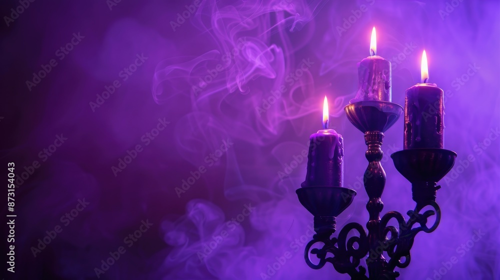 Fototapeta premium Candle holder with purple backlight creating spooky or romantic vibe Banner with space for text