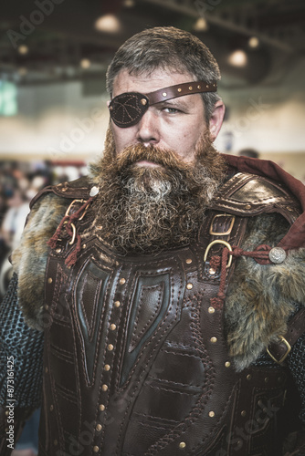 Portrait of a male cosplayer dressed as a Viking barbarian