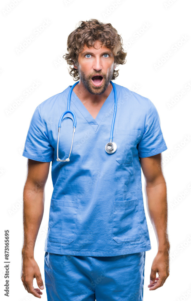 Handsome hispanic surgeon doctor man over isolated background afraid and shocked with surprise expression, fear and excited face. Handsome hispanic surgeon doctor man over isolated background afraid and shocked with surprise expression, fear and excited face.