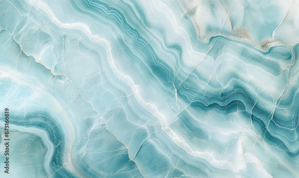 Obraz premium An abstract image made of light blue marble with soft, flowing patterns and delicate white veins, creating a serene and elegant background.