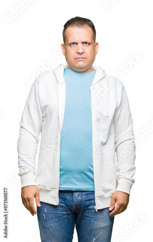 Middle age arab man wearing sweatshirt over isolated background Relaxed with serious expression on face. Simple and natural looking at the camera.