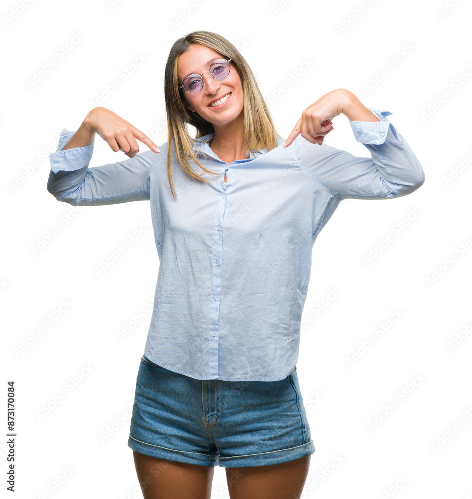 Young beautiful woman wearing sunglasses over isolated background looking confident with smile on face, pointing oneself with fingers proud and happy. Young beautiful woman wearing sunglasses over isolated background looking confident with smile on face, pointing oneself with fingers proud and happy.