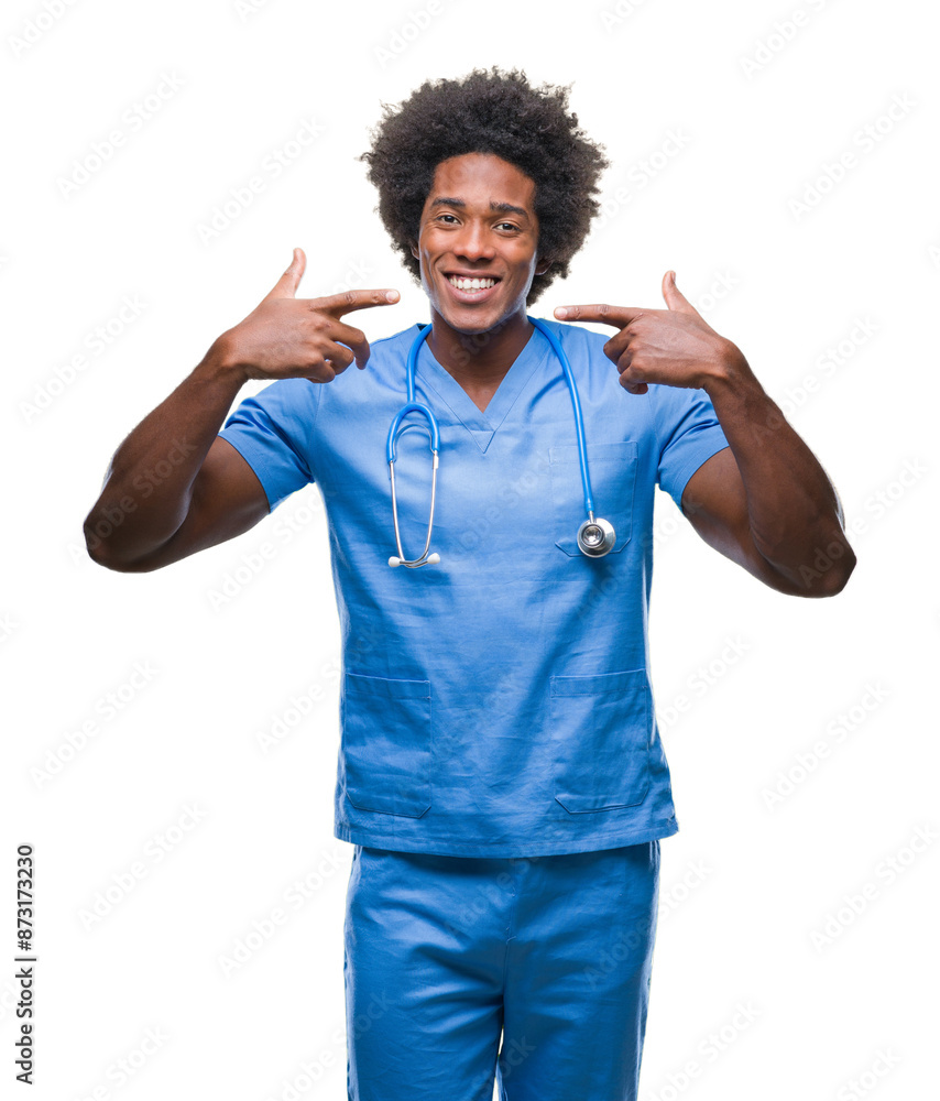 Afro american surgeon doctor man over isolated background smiling confident showing and pointing with fingers teeth and mouth. Health concept. Afro american surgeon doctor man over isolated background smiling confident showing and pointing with fingers teeth and mouth. Health concept.