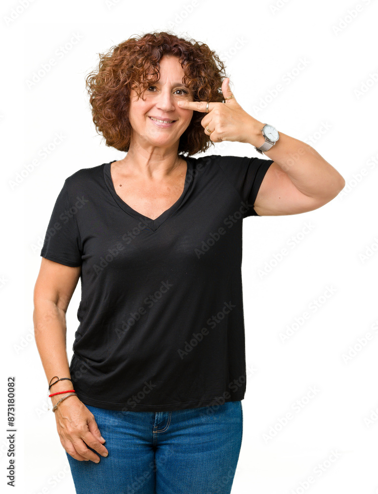 Beautiful middle ager senior woman over isolated background Pointing with hand finger to face and nose, smiling cheerful Beautiful middle ager senior woman over isolated background Pointing with hand finger to face and nose, smiling cheerful