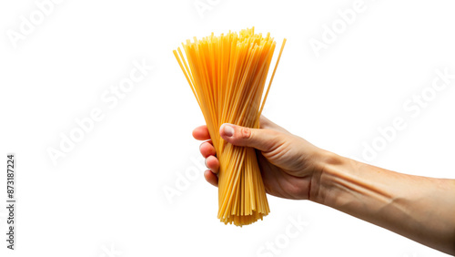 A close-up of a hand holding dry yellow spaghetti, a key ingredient in Italian cuisine