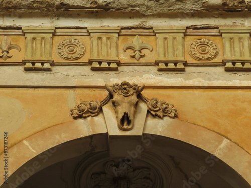 Historic architecture in the town of Manacor. Detail of keystone with skull and classic cornice. Mallorca Island. Spain.
