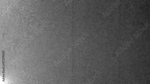 Black and white noisy, grainy television screen texture. Abstract scanned tv style film. Noise gray background. Vintage archive pattern. Retro 4k footage. Real grain monitor. Scanned overlay effect