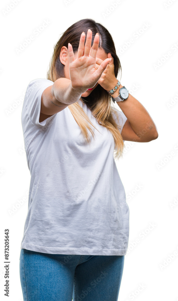 Young beautiful woman casual white t-shirt over isolated background covering eyes with hands and doing stop gesture with sad and fear expression. Embarrassed and negative concept. Young beautiful woman casual white t-shirt over isolated background covering eyes with hands and doing stop gesture with sad and fear expression. Embarrassed and negative concept.