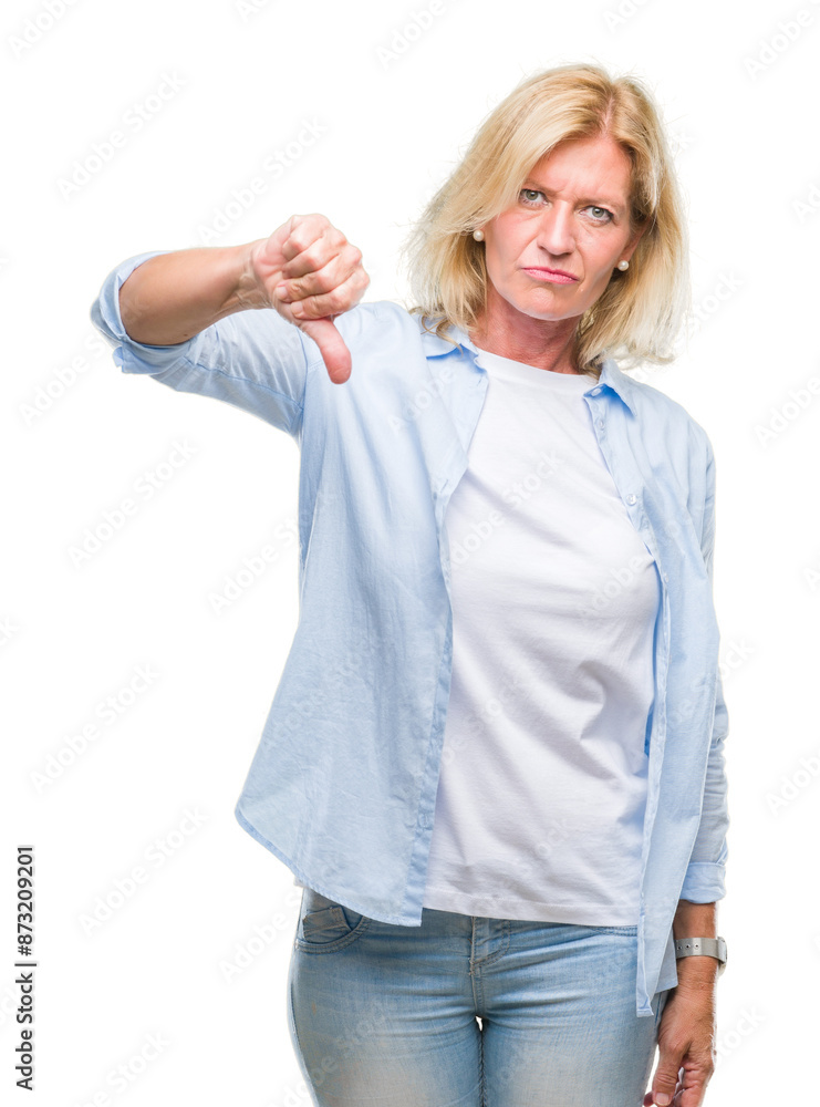 Middle age blonde woman over isolated background looking unhappy and angry showing rejection and negative with thumbs down gesture. Bad expression. Middle age blonde woman over isolated background looking unhappy and angry showing rejection and negative with thumbs down gesture. Bad expression.