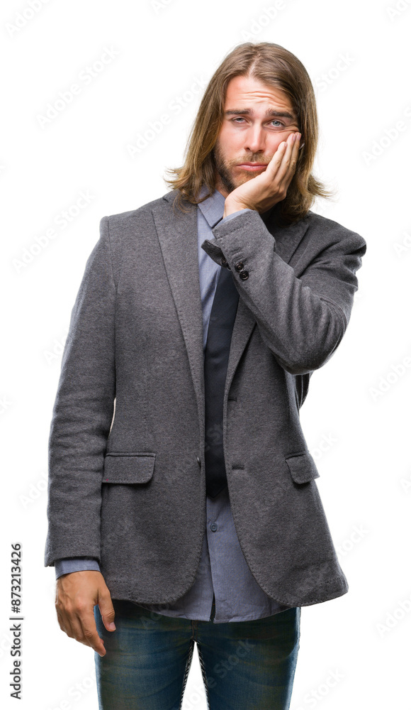 Young handsome business man with long hair over isolated background thinking looking tired and bored with depression problems with crossed arms. Young handsome business man with long hair over isolated background thinking looking tired and bored with depression problems with crossed arms.