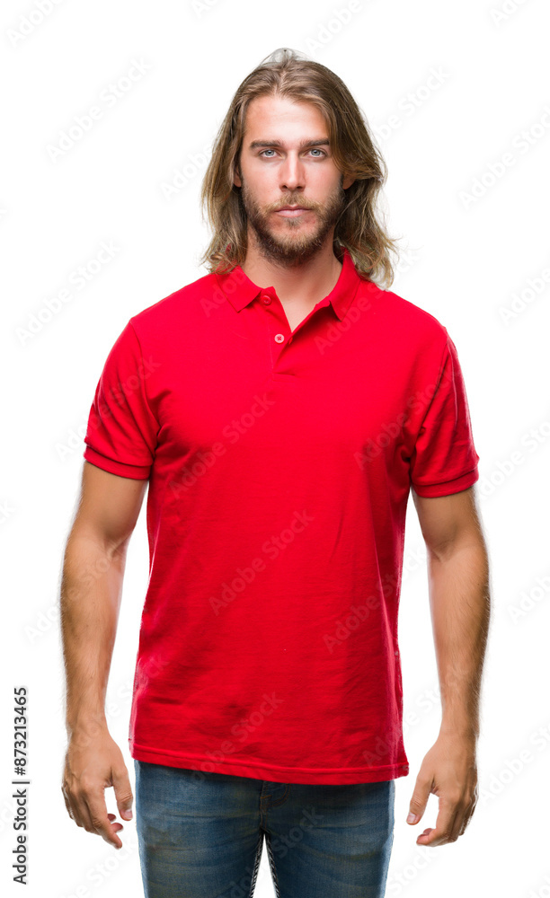 Young handsome man with long hair over isolated background with serious expression on face. Simple and natural looking at the camera. Young handsome man with long hair over isolated background with serious expression on face. Simple and natural looking at the camera.