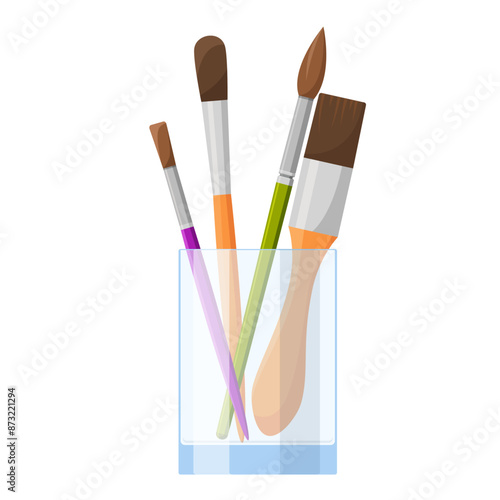 Proffesional painting brushes in glass cup isolated on white background.

