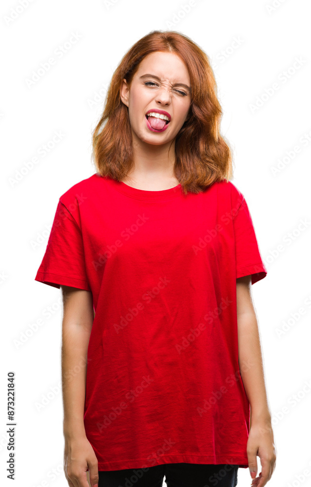 Young beautiful woman over isolated background sticking tongue out happy with funny expression. Emotion concept. Young beautiful woman over isolated background sticking tongue out happy with funny expression. Emotion concept.