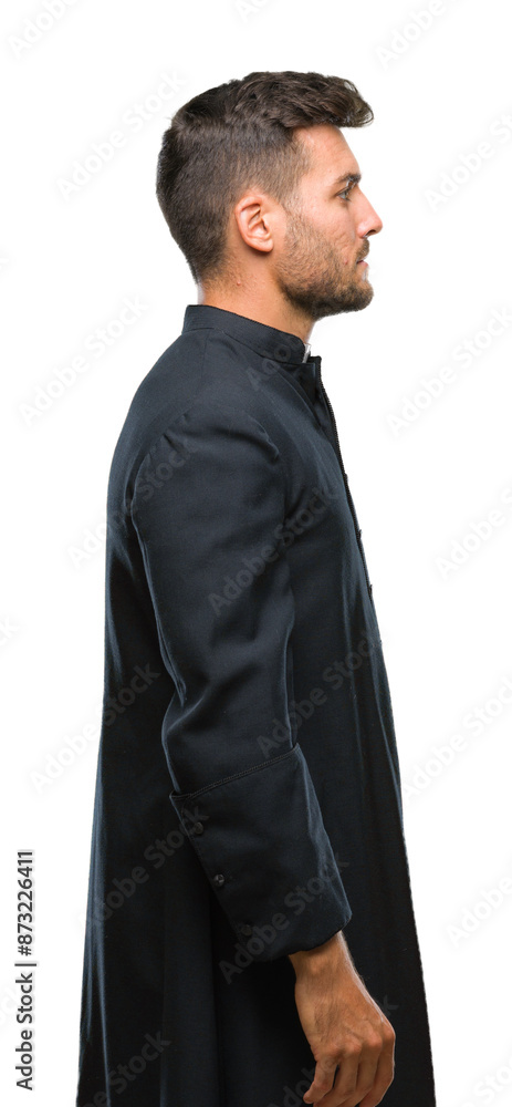 Young catholic christian priest man over isolated background looking to side, relax profile pose with natural face with confident smile. Young catholic christian priest man over isolated background looking to side, relax profile pose with natural face with confident smile.