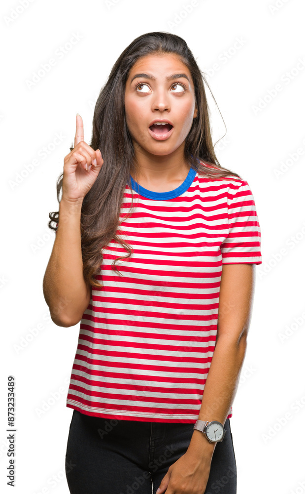 Young beautiful arab woman over isolated background pointing finger up with successful idea. Exited and happy. Number one. Young beautiful arab woman over isolated background pointing finger up with successful idea. Exited and happy. Number one.