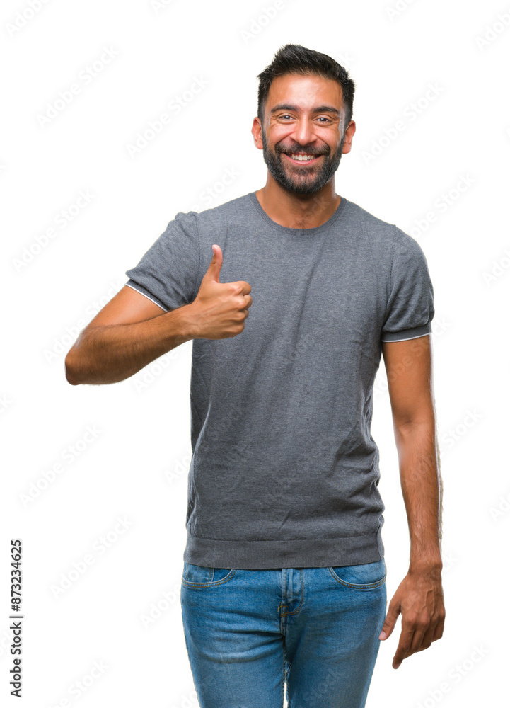 Adult hispanic man over isolated background doing happy thumbs up gesture with hand. Approving expression looking at the camera with showing success. Adult hispanic man over isolated background doing happy thumbs up gesture with hand. Approving expression looking at the camera with showing success.