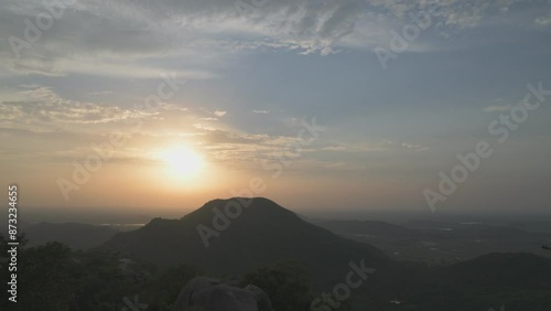 Time lapse sunset over The Barabar Hill Caves बराबर, are the oldest surviving rock-cut caves in India, dating from Maurya Empire some with Ashokan inscriptions, Makhdumpur, Jehanabad, gaya, Bihar photo