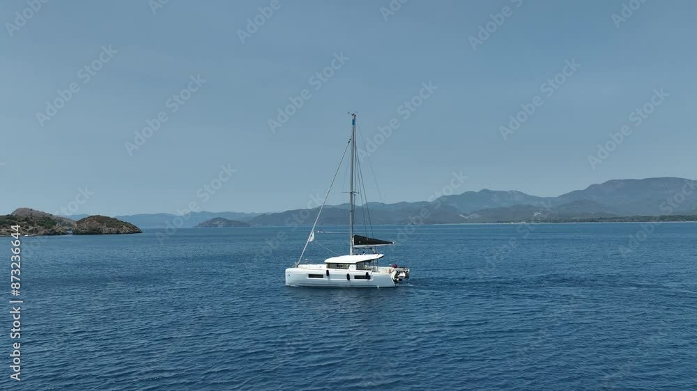Aerial view of a moored yacht boat in beautiful calm sea bay with turquoise water near Fethiye, Turkey. Full circle around luxury Aerial view of a moored yacht boat in beautiful calm sea bay with turquoise water near Fethiye, Turkey. Full circle around luxury