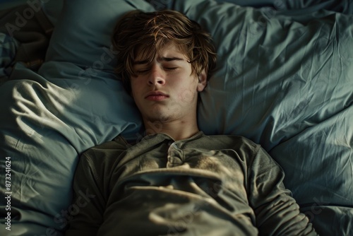 Teen Boy Sleeping Peacefully in Bed  © Rumpa