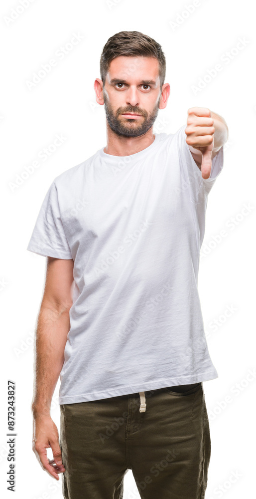 Young handsome man over isolated background looking unhappy and angry showing rejection and negative with thumbs down gesture. Bad expression. Young handsome man over isolated background looking unhappy and angry showing rejection and negative with thumbs down gesture. Bad expression.