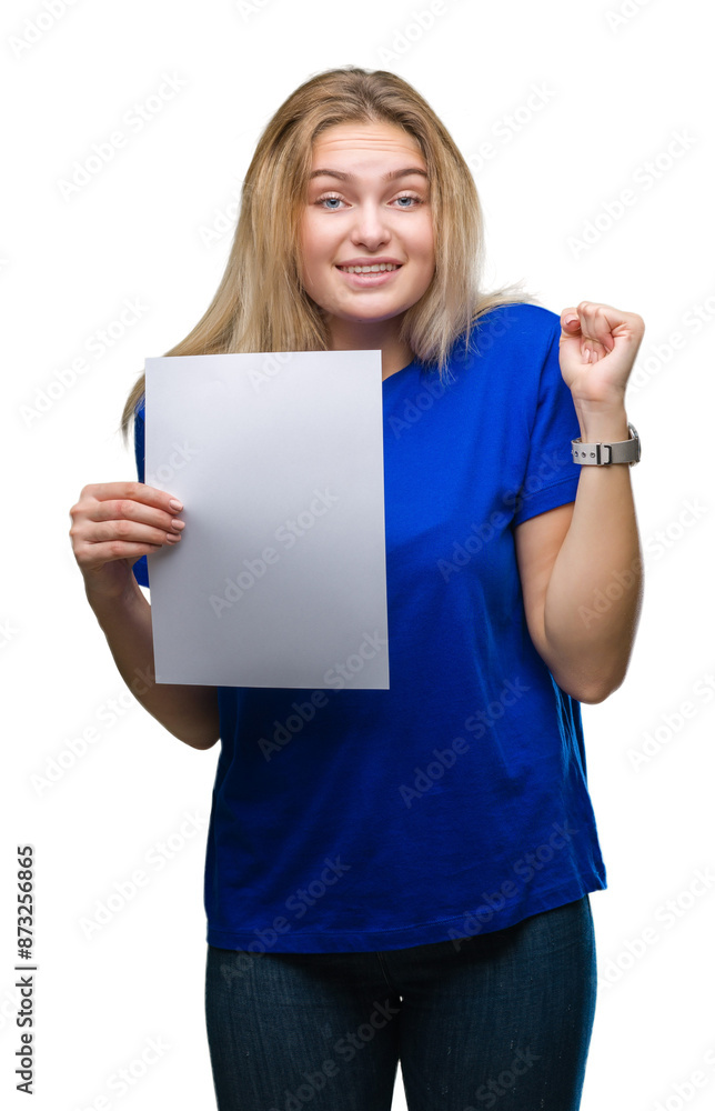 Young caucasian woman holding blank paper sheet over isolated background screaming proud and celebrating victory and success very excited, cheering emotion Young caucasian woman holding blank paper sheet over isolated background screaming proud and celebrating victory and success very excited, cheering emotion