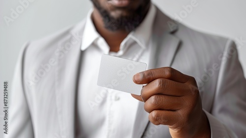 Man Holding Blank Business Card Close-Up photo