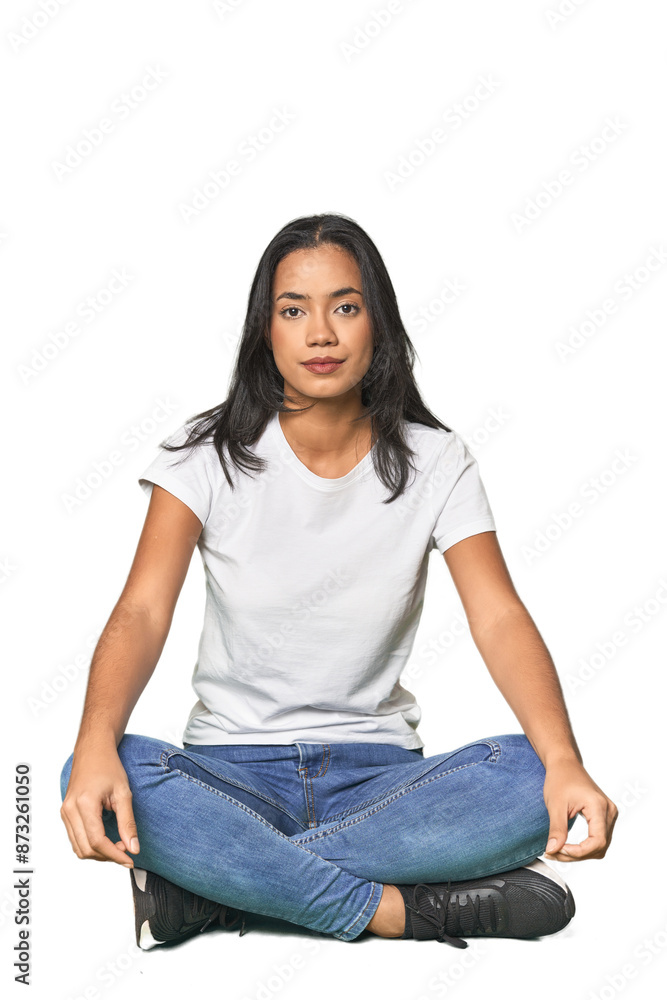 Elegant Latina sitting and posing in studio Elegant Latina sitting and posing in studio