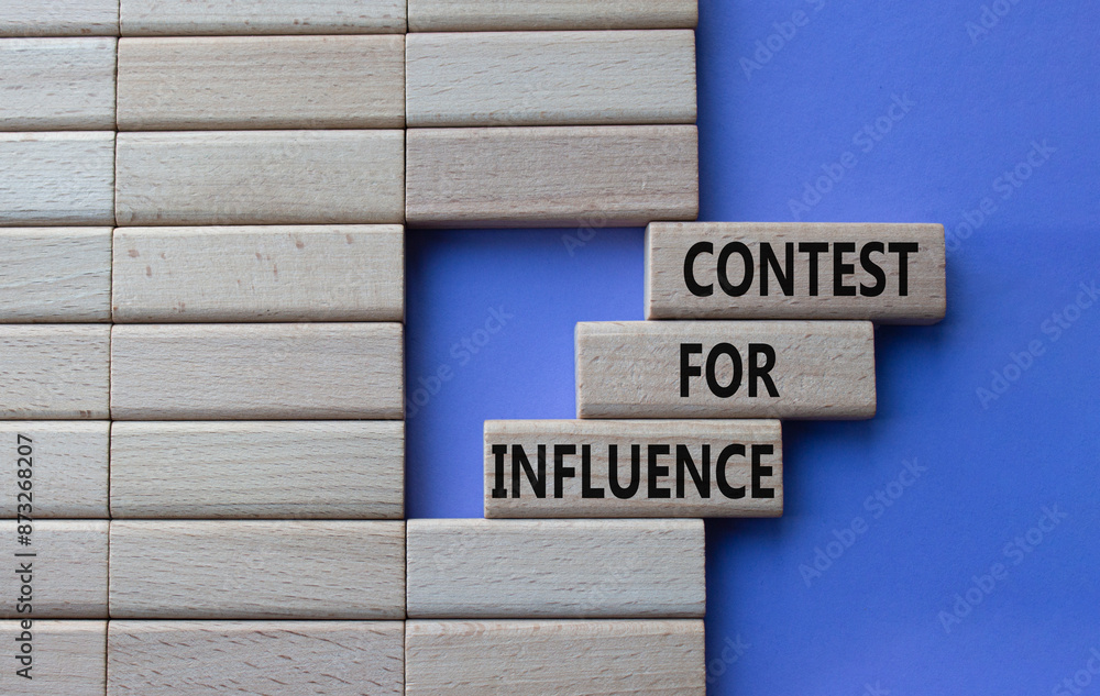 Contest for Influence symbol. Wooden blocks with words Contest for Influence. Beautiful purple background. Business and Contest for Influence concept. Copy space. Contest for Influence symbol. Wooden blocks with words Contest for Influence. Beautiful purple background. Business and Contest for Influence concept. Copy space.