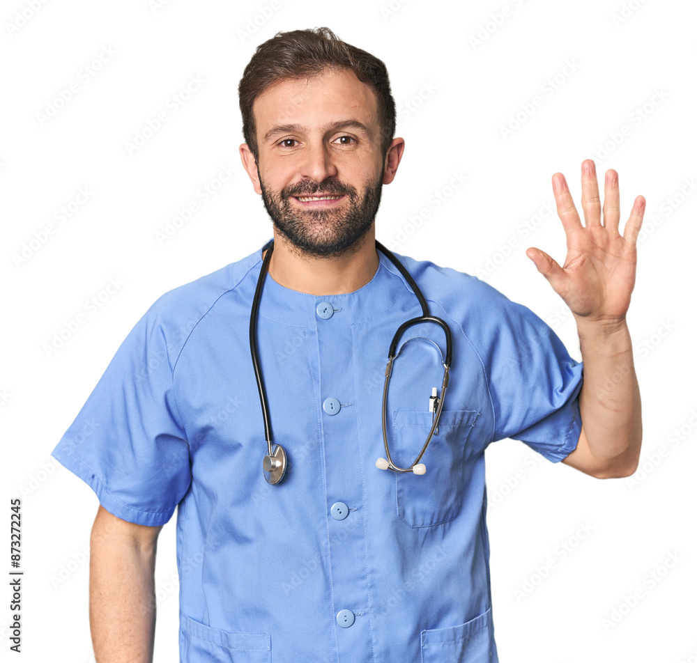 Hispanic male nurse in studio smiling cheerful showing number five with fingers. Hispanic male nurse in studio smiling cheerful showing number five with fingers.