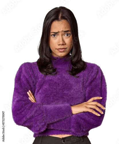 Young filipino woman unhappy looking in camera with sarcastic expression.