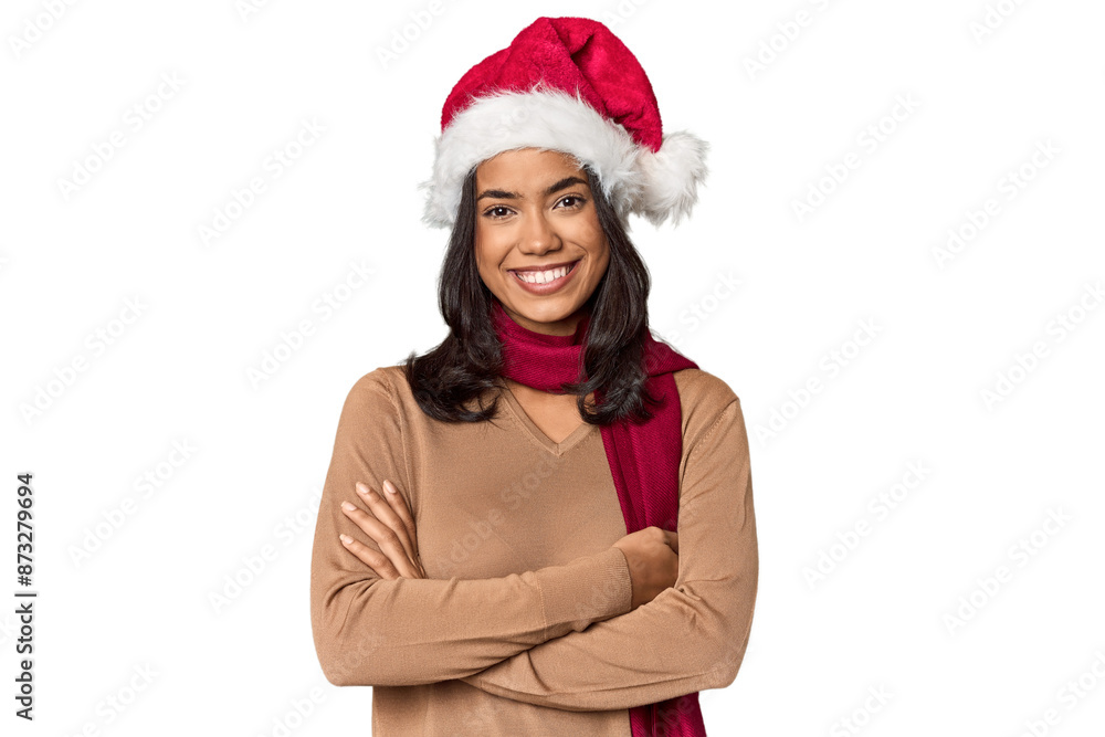 Young Filipino woman in Santa hat, festive mood Young Filipino woman in Santa hat, festive mood