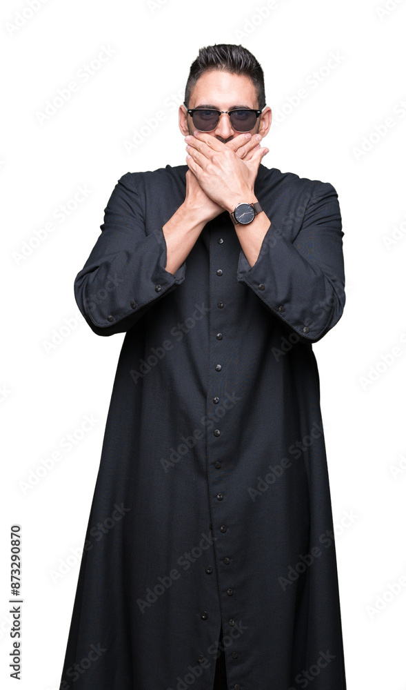Φωτογραφία Young Christian priest wearing sunglasses over isolated background shocked covering mouth with hands for mistake